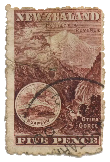A wooded gorge with a small round picture of a volcano; stamp issued by New Zealand, 1898