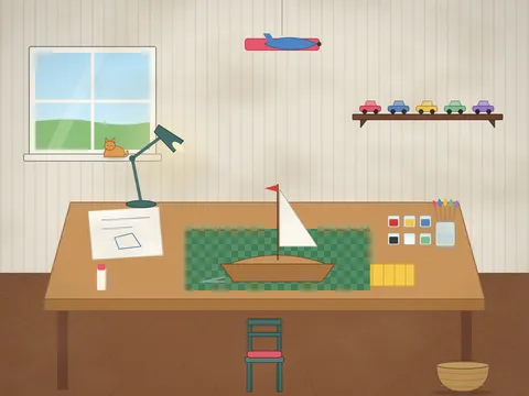 A hobby desk under a lamp: a model sailing boat half built on a stand, sheets of instructions, tiny paint pots, brushes in a jar, tweezers, glue, a cutting mat, a box of small parts, a ruler, a finished model plane hanging from the ceiling, a shelf of model cars and a cat on the windowsill.