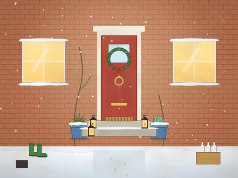 The front of a brick cottage on a winter evening: a red door with a holly wreath and brass knocker, glowing windows, lanterns on the steps, pots of winter plants, wellington boots, a boot scraper, a milk crate, a snowy path, a bare climbing rose and a cat looking out of the window.